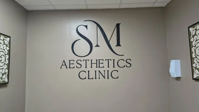 SM Aesthetics Clinic logo on the wall